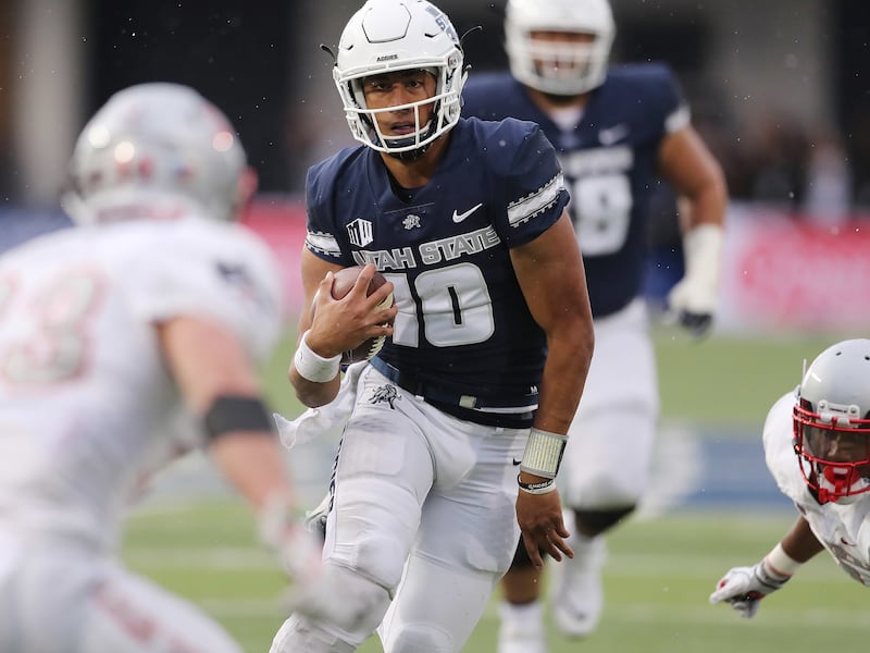 Utah State Aggies quarterback Jordan Love runs against UNLV in Logan on Saturday, Oct. 13, 2018.