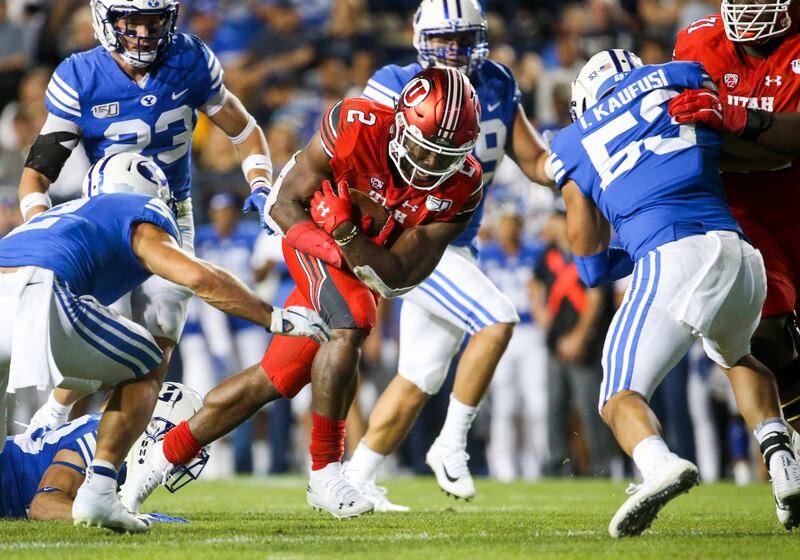 Utah running back Zack Moss (2) runs the ball near the goal line during the Utah-BYU football game.