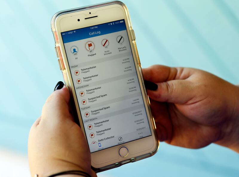 FILE - This Tuesday, Aug. 1, 2017, file photo, shows a call log displayed via an AT&T app on a cellphone in Orlando, Fla. The app helps locate and block fraudulent calls, although some robocalls do get through. A federal appeals court has rolled back rule