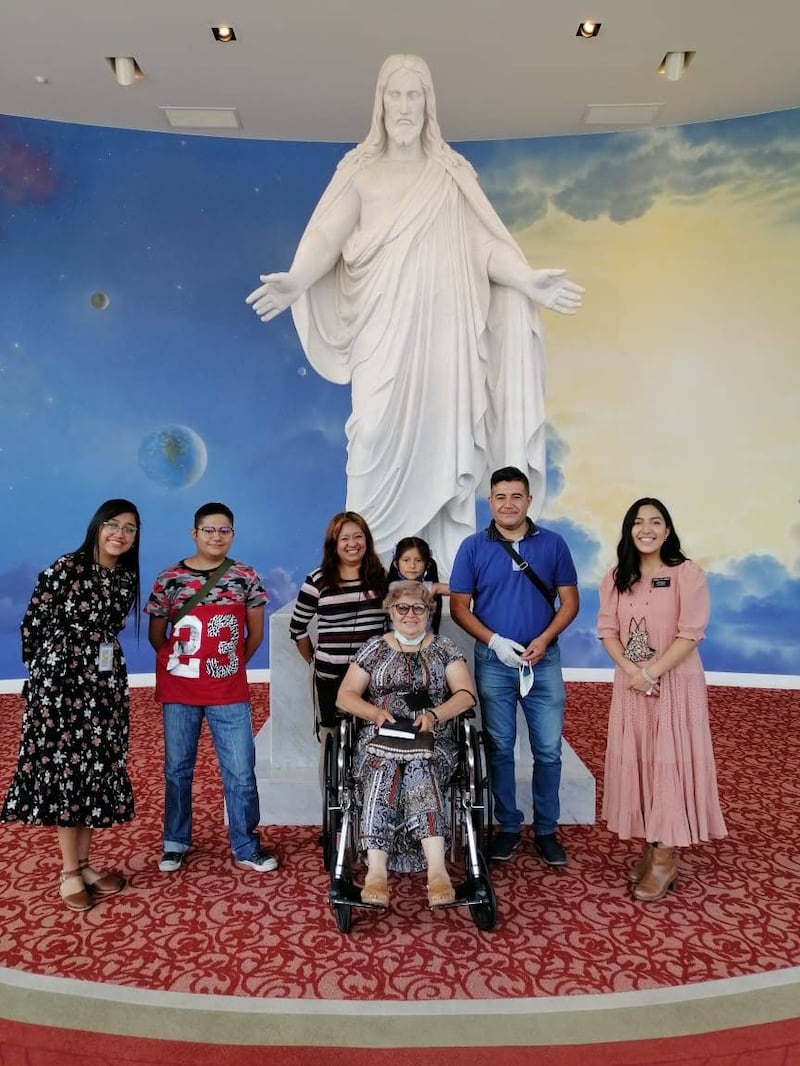 Amy Ortiz, far right, and her missionary companion, Brenda Mancía, far left, pause for a photo with the Rabadan family at the end of a tour of the Mexico City Temple Visitors' Center on May 8, 2022.