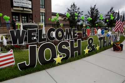 A sign greeting Josh Holt and his wife Thamy outside the Old Dome Meeting Hall at Riverton City Park in Riverton, Utah, Monday, May 28, 2018.