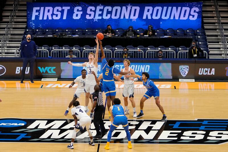 BYU forward Matt Haarms goes up for the tipoff with UCLA forward Cody Riley during NCAA Tournament game at Hinkle Fieldhouse.