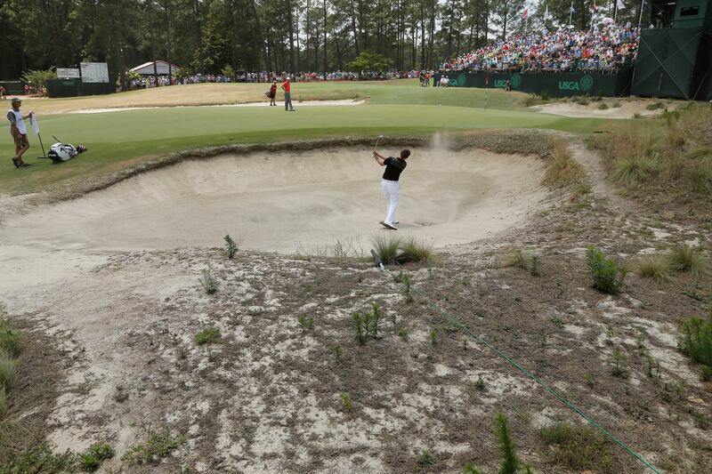 FILE - Matthew Fitzpatrick, of England, hits out of the bunker on the 16th hole during the third round of the U.S. Open golf tournament in Pinehurst, N.C., Saturday, June 14, 2014. The famed No. 2 course is hosting the U.S. Open for the fourth time on June 13-16, 2024.(AP Photo/Charlie Riedel, File)