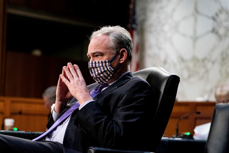 Sen. Tim Kaine, D-Va., listens during a Senate Health, Education, Labor and Pensions Committee hearing on the federal coronavirus response on Capitol Hill in Washington, Thursday, March 18, 2021. Kaine said he still experiences “weird” COVID-19 symptoms about one year after he was first diagnosed.