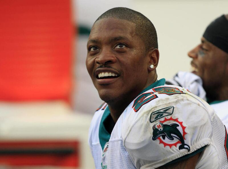 In this Nov. 20, 2011 file photo, Miami Dolphins cornerback Will Allen looks on during the second half of an NFL football game against the Buffalo Bills, in Miami Gardens, Fla. Federal regulators on Monday, April 6, 2015 announced they have filed civil fr