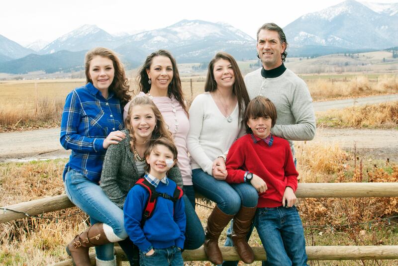 Stacy (middle left) and Jason Bingham (top right) are pictured with their five children, Sierra, Megan, Lindsey, Hunter and Gage.