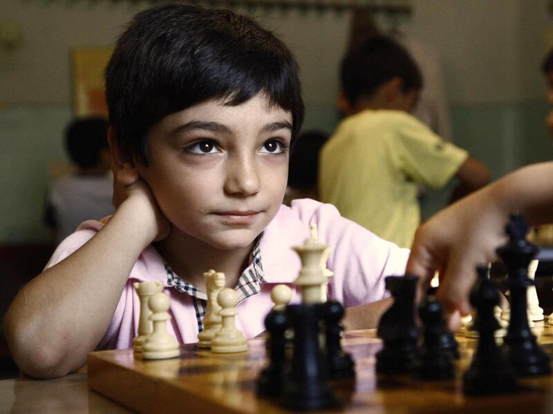 In this photo taken Tuesday, Sept. 20, 2011, David Ayrapetyan plays a game of chess at his chess class in Yerevan. Tiny Armenia is a big player in world chess, and a new gambit could make it even bigger: mandatory chess in school. The only thing 8-year-ol