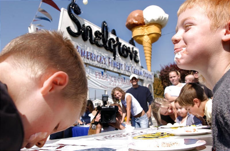 Four-year-old Zachary Allen, left, and Caleb Rogers, 5, slurp up ice cream during a contest at Snelgrove Ice Cream in September 2003. The event was held to celebrate Snelgrove's 75th anniversary.
