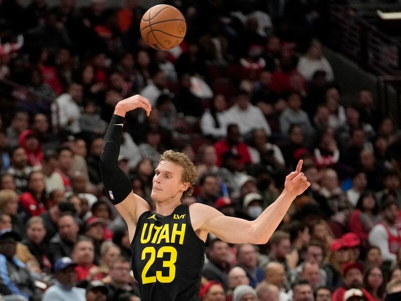 Utah Jazz’s Lauri Markkanen saves a ball from going out of bounds vs. Chicago Bulls, Nov. 6, 2023, in Chicago.