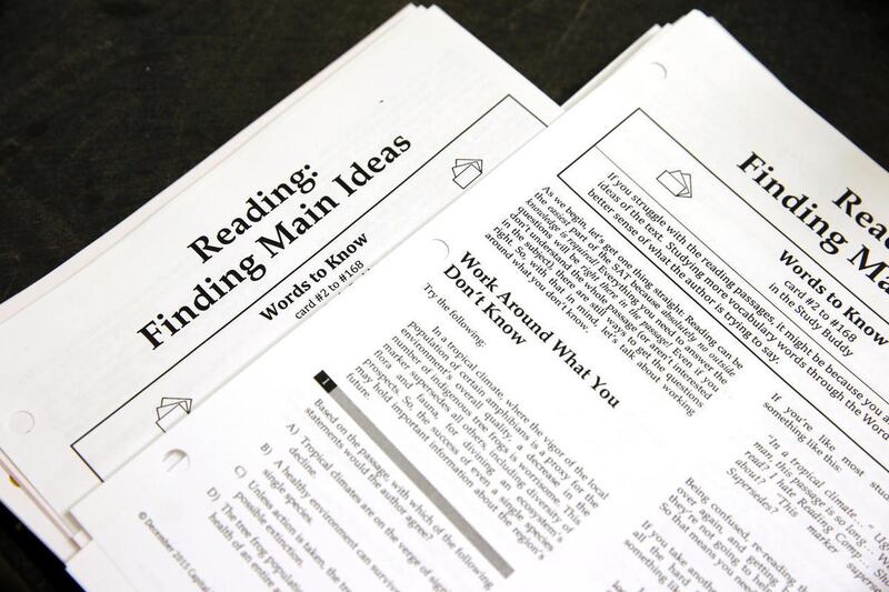 FILE - In this Jan. 17, 2016 file photo, students work sheets are seen at a college test preparation class at Holton Arms School in Bethesda, Md. The $380 million test coaching industry is facing competition from free or low-cost alternatives in what the