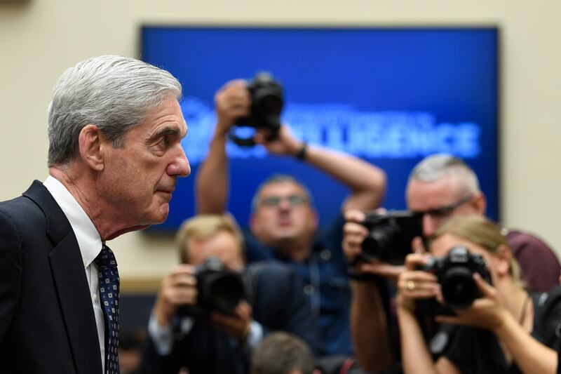 Former special counsel Robert Mueller returns to the witness table following a break in his testimony before the House Intelligence Committee on Capitol Hill in Washington, Wednesday, July 24, 2019. Mueller testified about his report on Russian election i