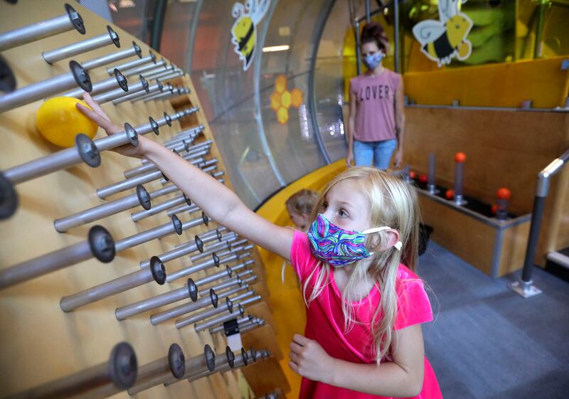 Analyn Schwer wears a mask while playing at the Discovery Gateway Children’s Museum in Salt Lake City.