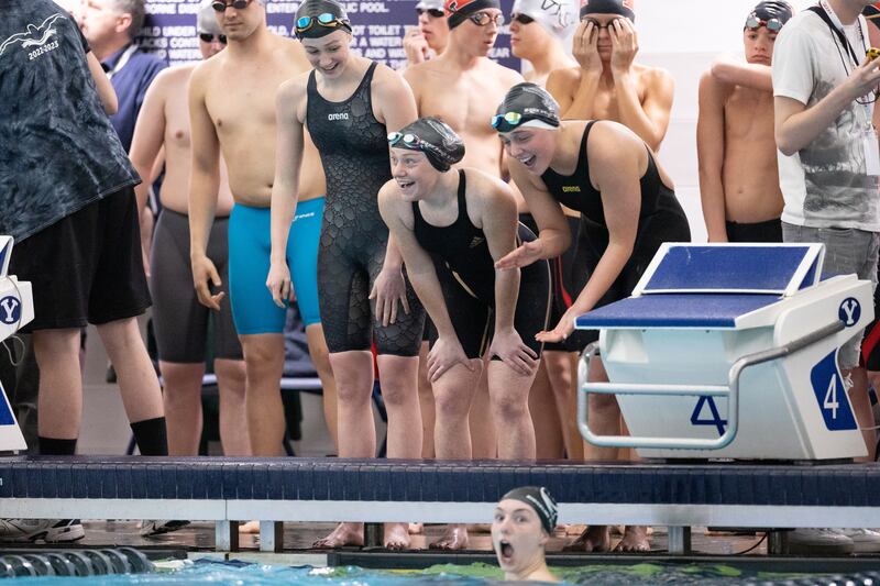 Ridgeline’s women’s 200-yard medley relay team celebrates after winning during the 4A high school state swim finals at the Stephen L. Richards Building in Provo on Saturday, Feb. 11, 2023.