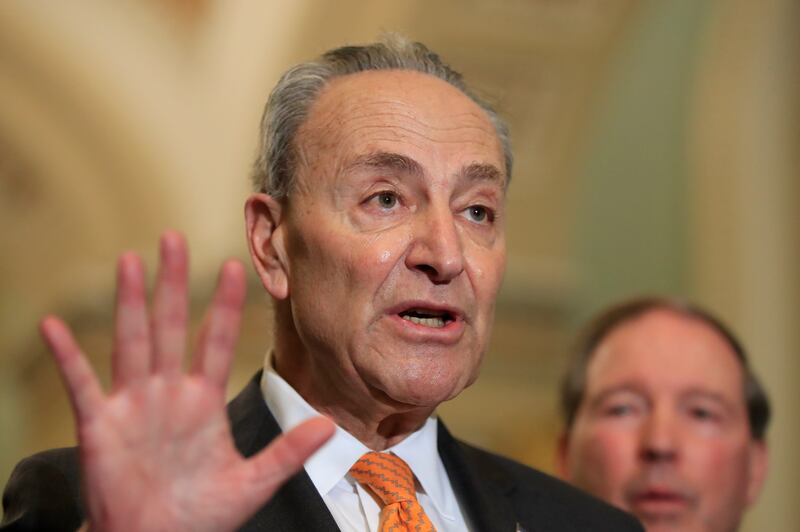 Senate Minority Leader Chuck Schumer, D-N.Y., with Sen. Tom Udall, D-N.M., speaks to reporters on Capitol Hill in Washington, Tuesday, Feb. 26, 2019.