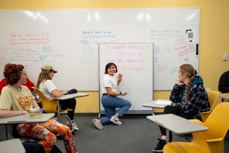 Khayla Murphy writes on a white board during a class at the Institute of Religion at the University of Utah on Nov. 15, 2023.