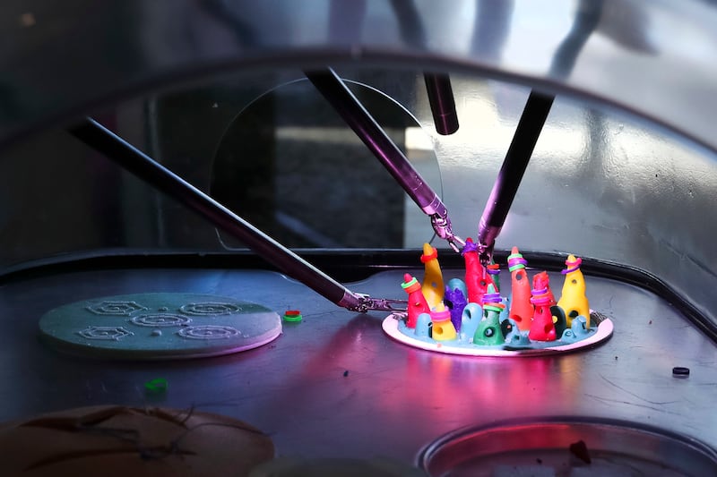 Jeff Studebaker, clinical sales manager for Intuitive Surgical, operates the da Vinci Surgical System remotely, moving tiny rubber bands onto cones during a Test Drive the Robot event at St. Mark’s Hospital in Millcreek on Wednesday, March 20, 2019.