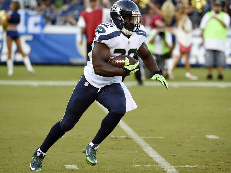Seattle Seahawks running back Robert Turbin runs against the Seattle Seahawks during the first half of an NFL preseason football game Saturday, Aug. 29, 2015, in San Diego. (AP Photo/Denis Poroy)