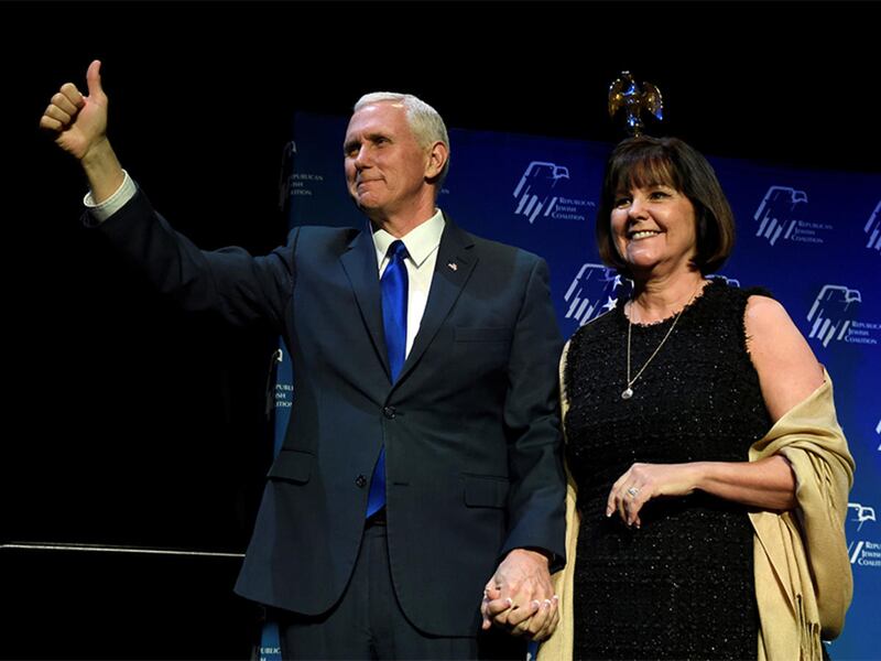 Vice President Mike Pence, left, and his wife, Karen Pence, acknowledge the audience before he speaks at the Republican Jewish Coalition\'s annual meeting in Las Vegas on Feb. 24, 2017.