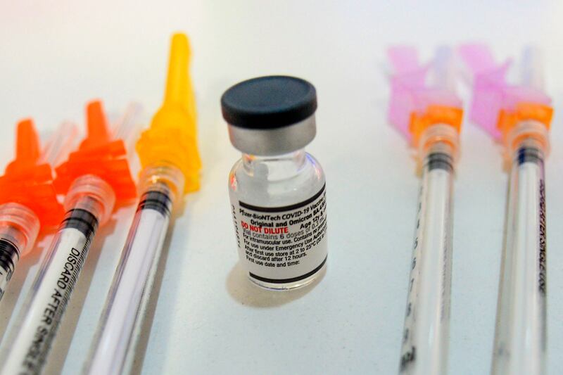 Booster shots of the Pfizer COVID-19 vaccine are displayed during a vaccine clinic.
