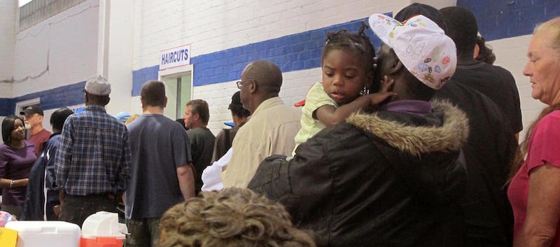 People wait in line for free haircuts as the annual Stand Down Against Homelessness gets underway Thursday, Oct. 27, 2011 in North Charleston, S.C. An estimated 3,000 people are expected to be helped during the two-day event, about 35 percent of them vete