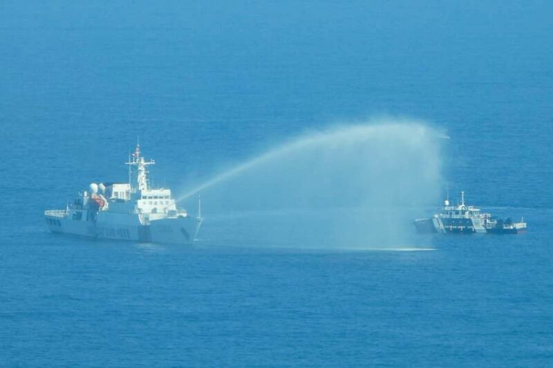 A Chinese Coast Guard ship uses its water cannons on a Philippine Bureau of Fisheries and Aquatic Resources vessel in the disputed South China Sea.