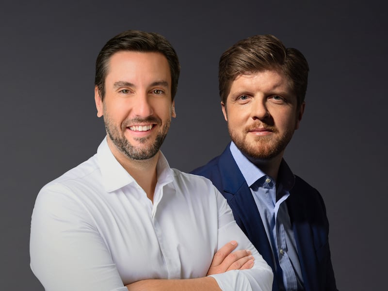 Clay Travis, left, is picture with Buck Sexton, in this publicity photo released in 2021.