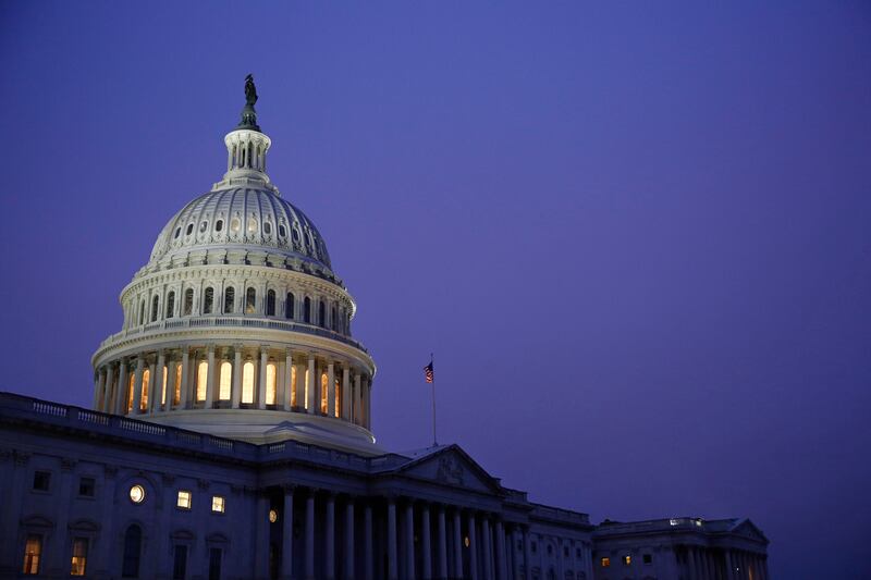 Light shines on the U.S. Capitol dome before a House Judiciary Committee markup of the articles of impeachment against President Donald Trump, Friday, Dec. 13, 2019, on Capitol Hill in Washington. Trump impeachment goes to full House after Judiciary panel approves charges of abuse of power, obstruction of Congress. (AP Photo/Patrick Semansky)