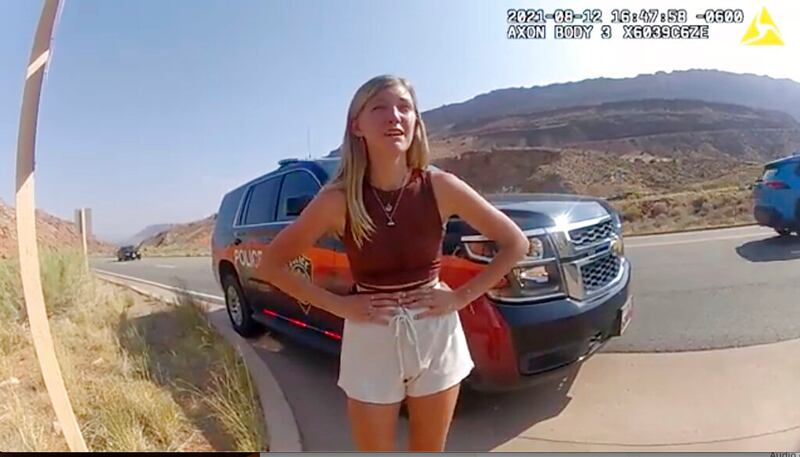 Gabrielle “Gabby” Petito talks to a police officer near the entrance to Arches National Park.