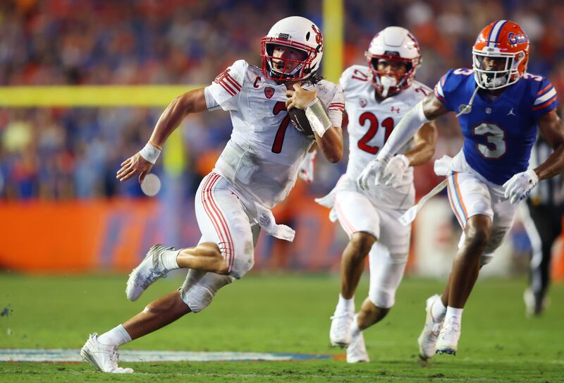 Utah quarterback Cameron Rising looks for defenders during loss to Florida in Gainesville, Fla., Sept. 3, 2022.