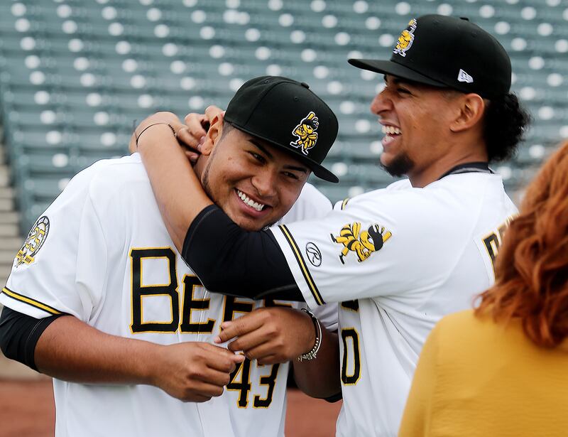 Bees' Jaime Barria and teammate Jose Briceno have some fun after talking with media members as the Salt Lake Bees hold their media day at Smiths Ballpark on Tuesday, April 2, 2019.