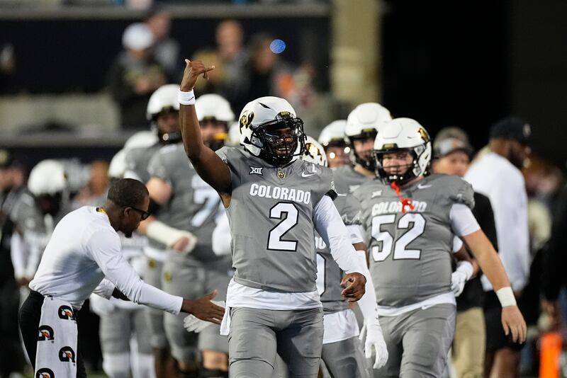 Colorado quarterback Shedeur Sanders (2) warms up before an NCAA college football game Saturday, Oct. 26, 2024, in Boulder, Colo.