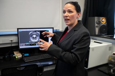 Forensic scientist Jennifer M. Gelston explains some of the options she and her colleagues have when comparing shell casings at the Utah State Crime Lab in Taylorsville on Monday, Aug. 27, 2018. Federal, state and local law enforcement leaders were at the