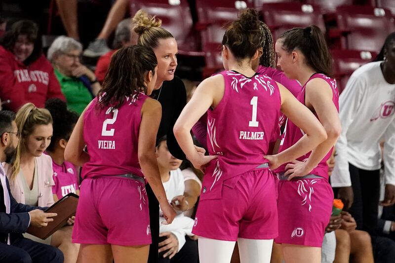 Utah coach Lynne Roberts talks to her team during game against Arizona State, Sunday, Feb. 19, 2023, in Tempe, Ariz.