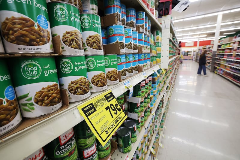 A shopper looks for food at Reams Food Store in Sandy on Friday, Sept. 23, 2022.