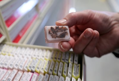 David Crockett, executive director of Intermountain Biorepository, shows a de-identified tissue sample after a press conference at the facility in South Salt Lake on Wednesday, June 12, 2019, to unveil the HerediGene: Population Study, which will focus on