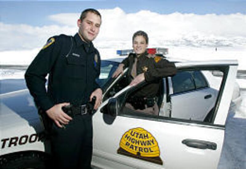 Tom and Dana Wallace both drive patrol cars and chase bad guys for a living. They work different shifts so one can be at home to care for their young daughter. Tom is an Orem police officer; Dana is a Utah Highway Patrol trooper.