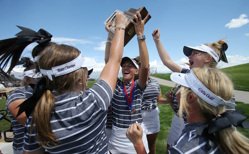 Lone Peak's team celebrates their 6A team win in the 6A golf championships at Talon's Cove in Saratoga Springs on Tuesday, May 14, 2019.