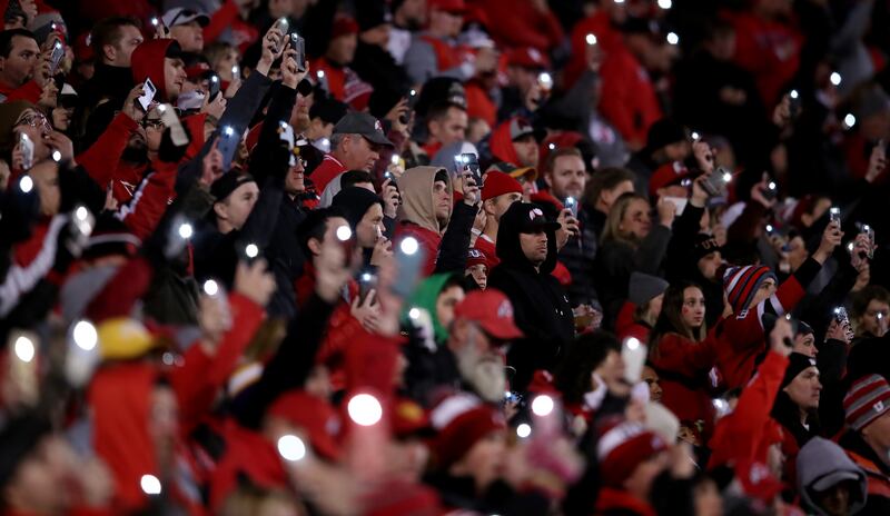 Utah fans hold their phone lights up