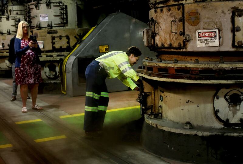 Jackie Wheeler, control room operator, gives a tour of the coal pulverizers that were installed in the 1940s at the Utah Power Plant in Magna on Wednesday, May 1, 2019. Rio Tinto Kennecott announced Wednesday the plant is being retired.