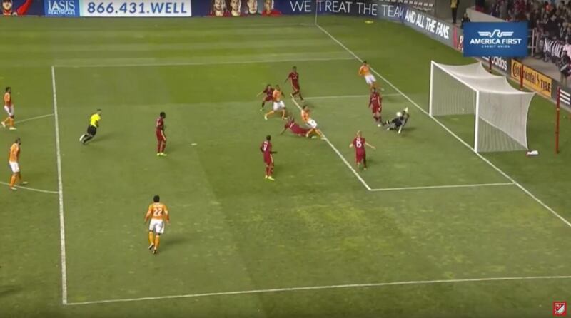 Nick Rimando blocks a goal with his face.