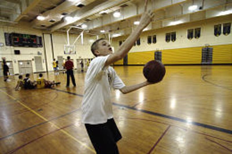 Greece Athena High basketball manager Jason McElwain shoots during practice Monday. McElwain scored 20 points in a game last week.