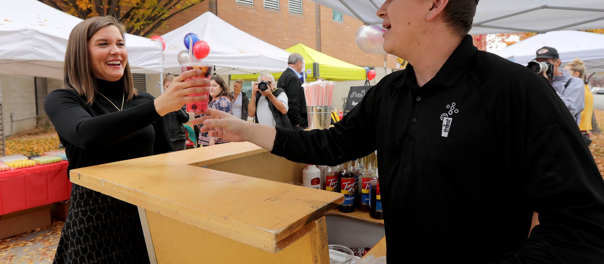 Salt Lake City Mayor Erin Mendenhall, left, gets a “spa water” from Thirst owner Ethan Cisneros on Monday, Nov. 1, 2021.