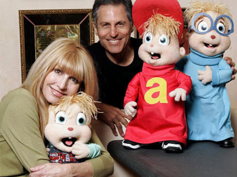 Ross Bagdasarian Jr. and his wife, Janice Karman, pose with stuffed versions of the Chipmunks, from left, Theodore, Alvin and Simon.