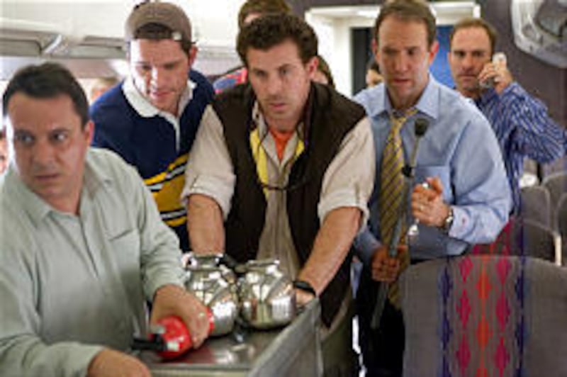 Passengers prepare to fight back against terrorists in a re-enactment of the final minutes of Flight 93.