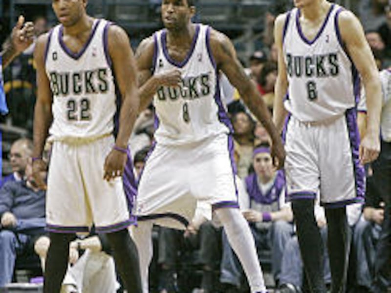 Milwaukee's Michael Redd, left, Joe Smith and Andrew Bogut are among a growing legion of NBA players donning tights under their shorts during games. The Bucks appear to unofficially lead the league in the interesting new fashion trend.
