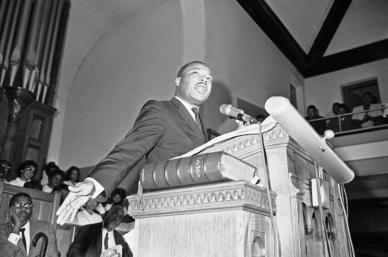 Martin Luther King Jr., tells a mass meeting in Birmingham, Alabama Sept. 17, 1963, that the words and actions of Alabama Gov. George Wallace were to blame for a church bombing.