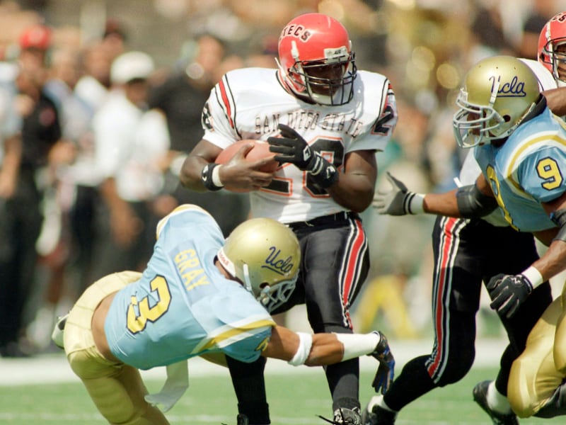 Marshall Faulk carries the ball during game against UCLA on Nov. 26, 1992, at the Rose Bowl in Pasadena, Calif.
