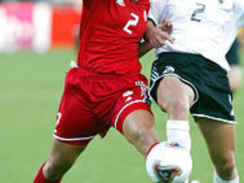 Canada's Christine Latham, left, and Germany's Kerstin Stegemann battle for the ball in the second half of a game at the Women's World Cup Saturday in Columbus. Germany won, as did Japan and Norway.