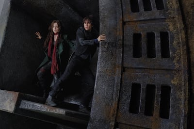 Hera Hilmar, left, as Hester Shaw and Robert Sheehan as Tom Natsworthy in “Mortal Engines.”