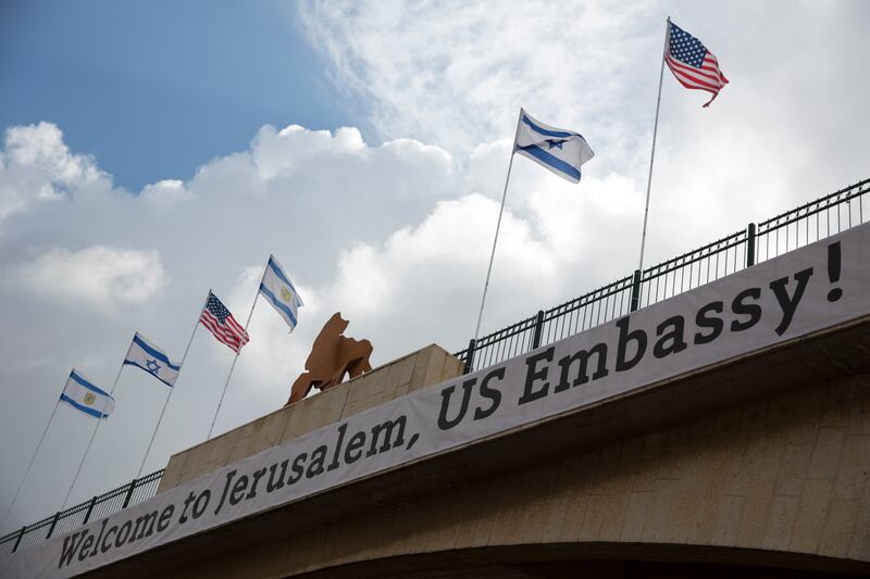 A sign on a bridge leading to the US Embassy compound ahead the official opening in Jerusalem, Sunday, May 13, 2018. Monday’s opening of the U.S. Embassy in contested Jerusalem, cheered by Israelis as a historic validation, is seen by Palestinians as an i